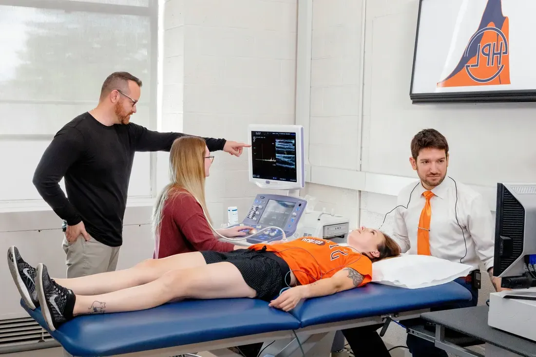 Students and professors in the exercise science laboratory.